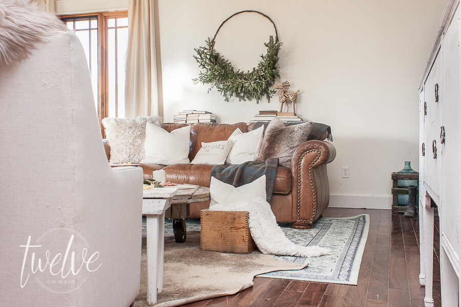 Farmhouse Christmas living room with handmade evergreen swag