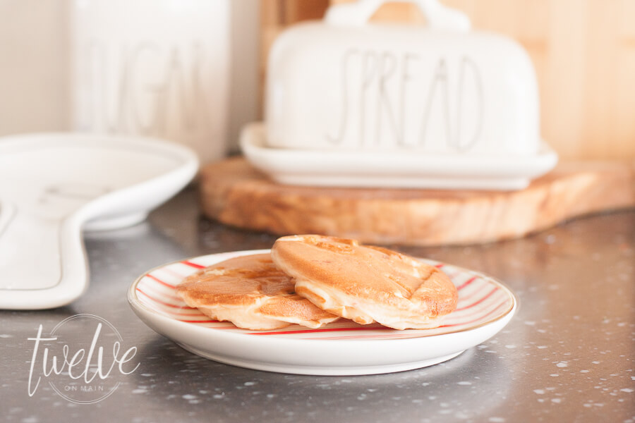 Red and white farmhouse Christmas kitchen and dining room decor is a classic way to decorate your space for the holidays.