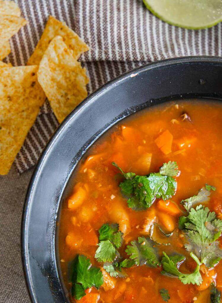 Make the easiest and tastiest chicken tortilla soup recipe ever! With instructions for the stovetop, crockpot and the InstaPot, this recipe works for your schedule.