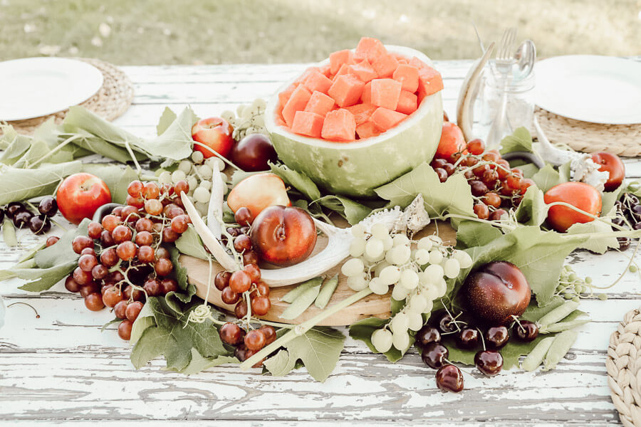Enjoy your summer with a gorgeous and delicious edible summer tablescape. Check out all these great ideas!