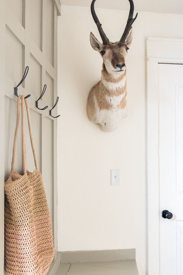This breezeway has a great functional design and the mudroom decor is simple and stylish without interfering with the functionality.