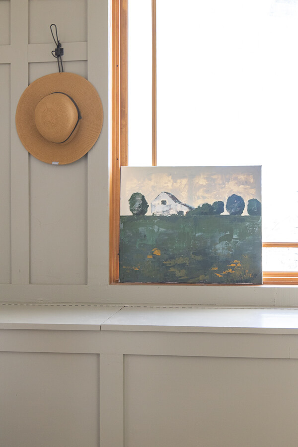 This breezeway has a great functional design and the mudroom decor is simple and stylish without interfering with the functionality.