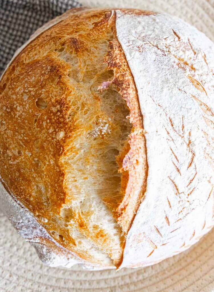 How to make an amazing dutch oven sourdough bread or sourdough boule!  This has step by step instructions that make it really easy to plan your time and you will realize how easy it is to make!