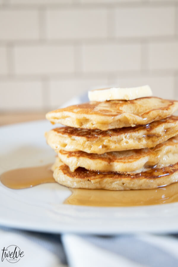 How to make light and fluffy whole wheat pancakes using your blender! These are the yummiest whole wheat pancakes, with a sweet nutty wheat flavor, and a light and fluffy texture.