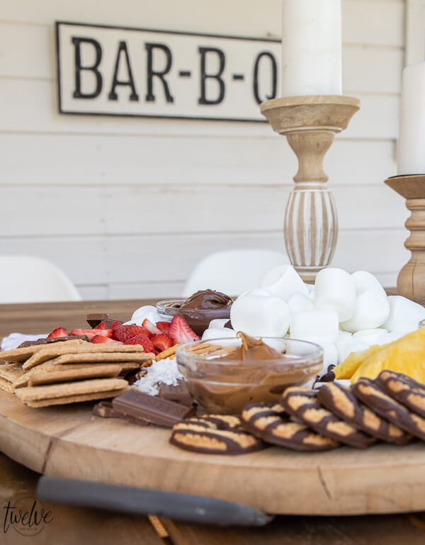 Create a super simple and fun s'mores charcuterie perfect for a night our with family. Filled with fruit, marshmallows, cookies, and more!