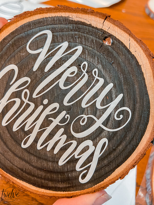 These handmade Christmas ornaments are the perfect gift to give to family and friends! Make them easily with wood rounds and cut the designs on the Cricut Maker. Don't have one? Let me tell you why you should get one!