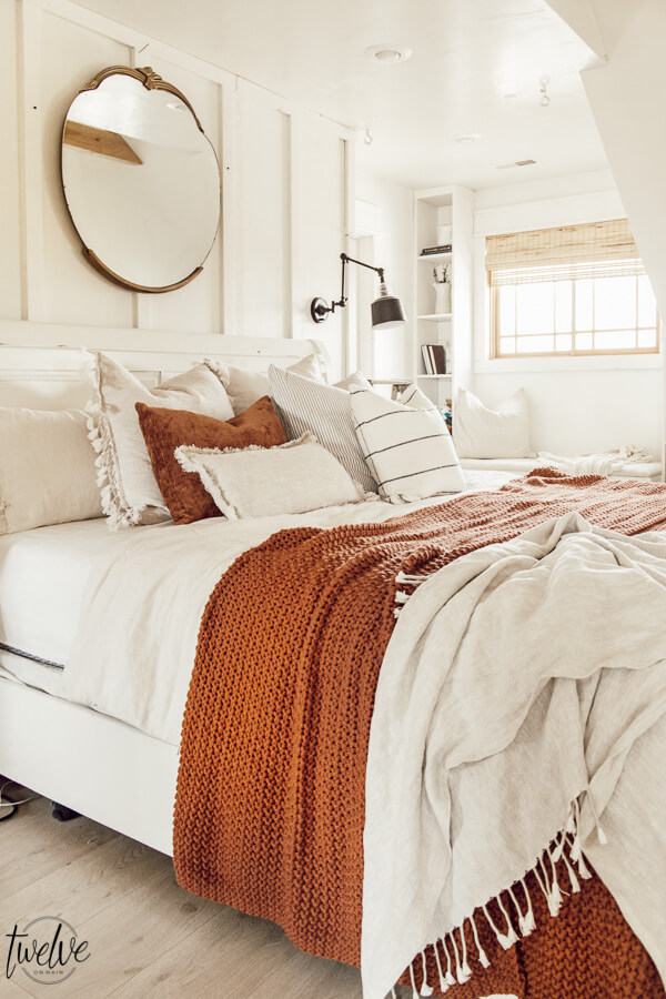 Cozy winter decor in the bedroom. Its easy to add accent colors and textures to give your space and warm and cozy feel that is perfect for winter.