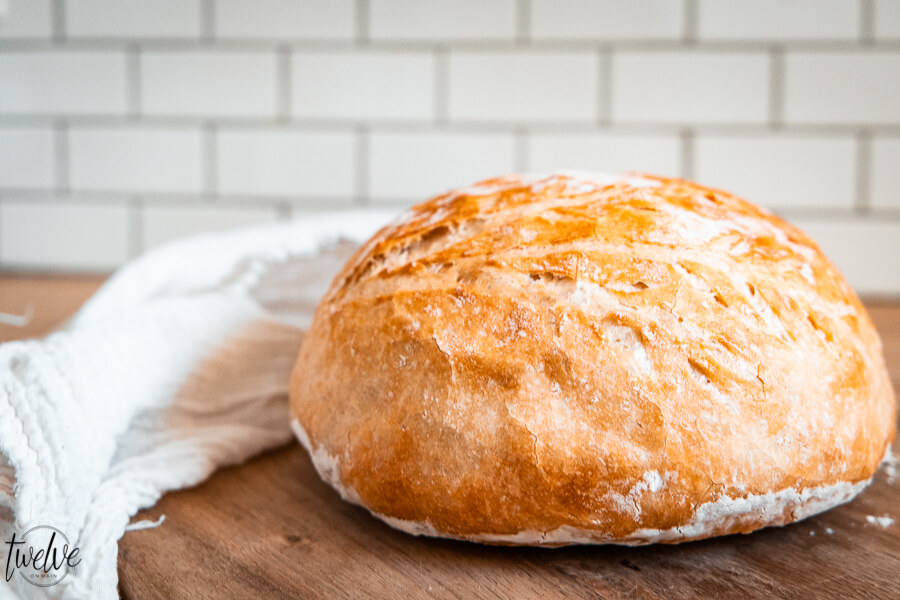How to make easy no knead bread in the dutch oven or on a sheet pan! This takes 5 minutes to prepare and you can set it and forget it until you are ready to bake it! Everyone will think you are a bread genius! Click here!