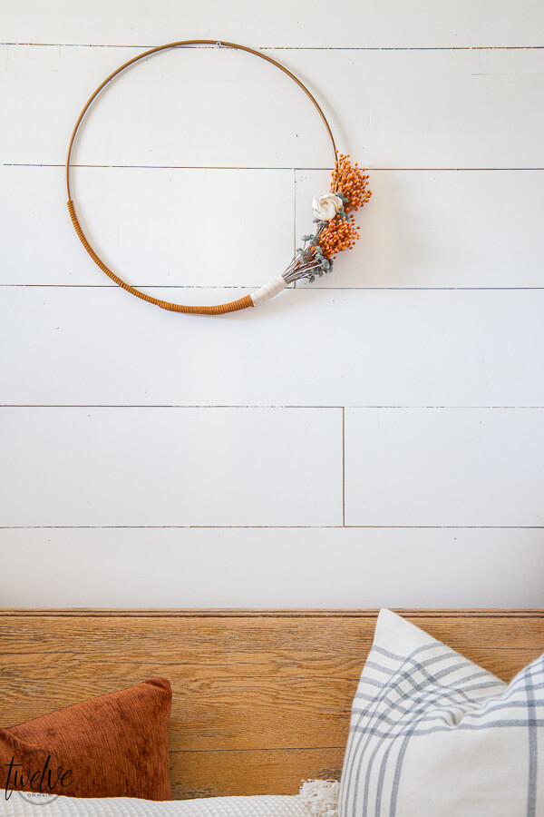 Gorgeous boho style hoop wreath for spring! This has beautiful dried flowers, twine and leather accents and will work in your home for more than just the spring season.