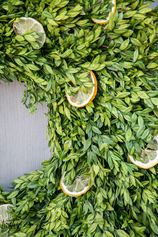 How to make a stylish boxwood and lemon summer wreath perfect for a front door or entry way. It is easy to create and inexpensive!