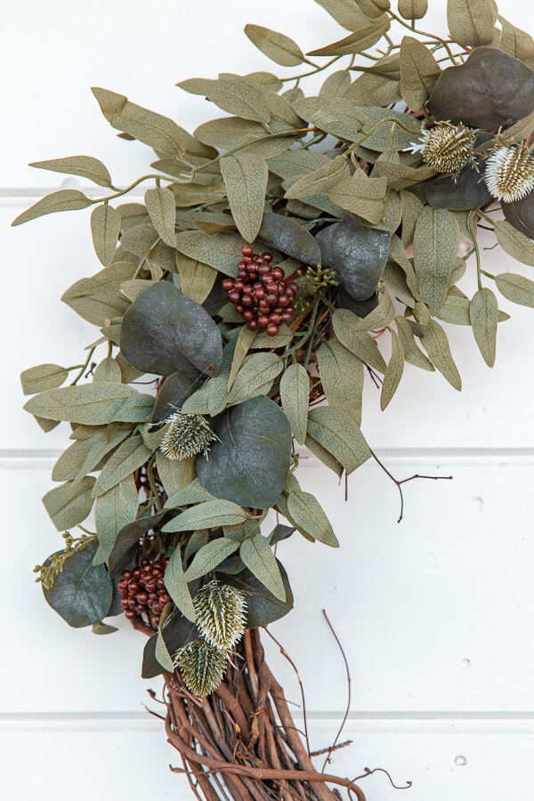 Make yourself a gorgeous and affordable DIY winter wreath that will brighten up your home, and make those long winter months more bright.