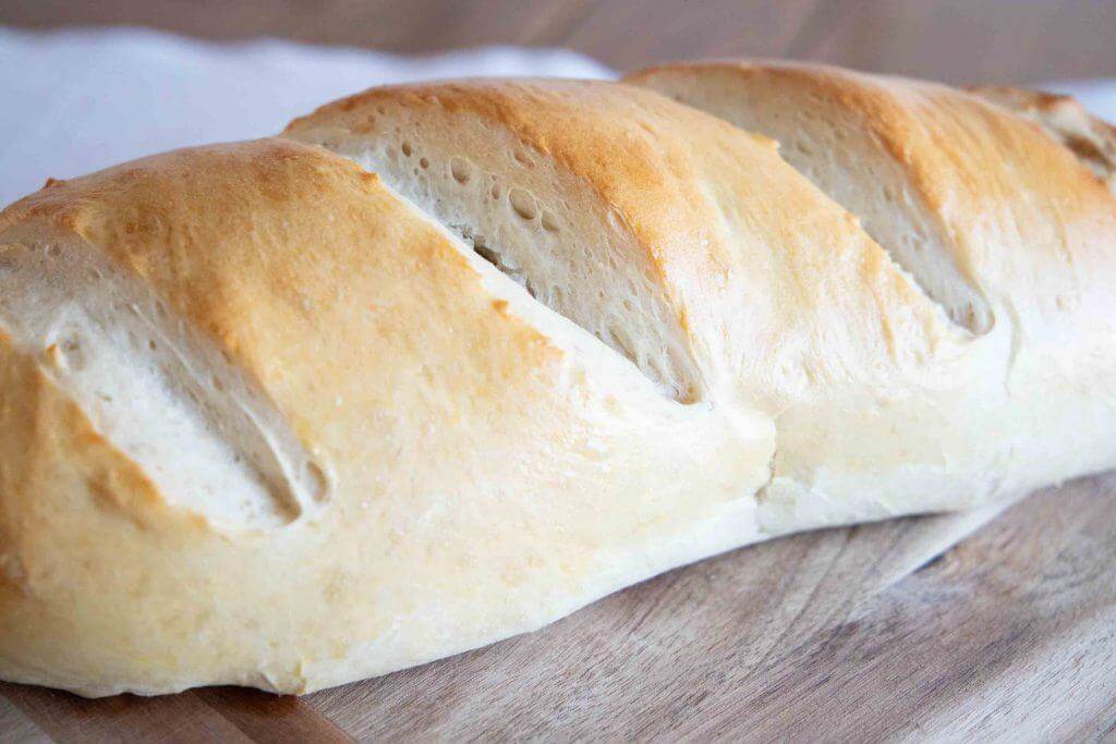 How to make amazing sourdough French bread using an active starter or sourdough discard. This bread is amazing and can be made in no time.
