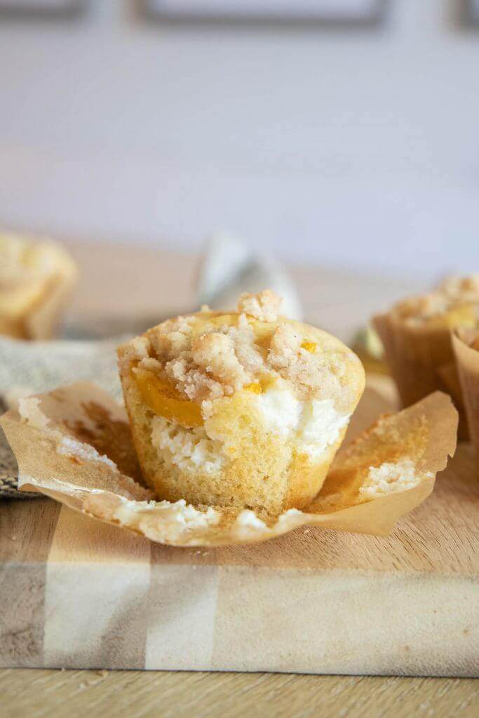 These amazing peach muffins with a cream cheese filling are the perfect way to use those peaches! Peaches and cream muffins for the win.