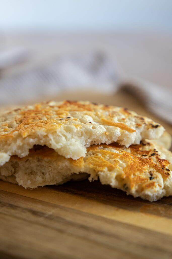 Make this easy 2 ingredient sourdough flatbread recipe. It is quick and easy, can be made in 5 minutes and has all the benefits of sourdough.  Top with your favorite seasonings and enjoy!