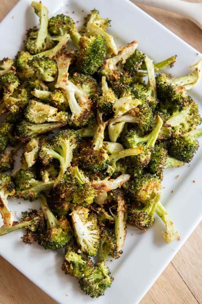 Make this easy roasted broccoli with parmesan as your next side dish. This is an easy side dish that can be made in about 25 minutes!