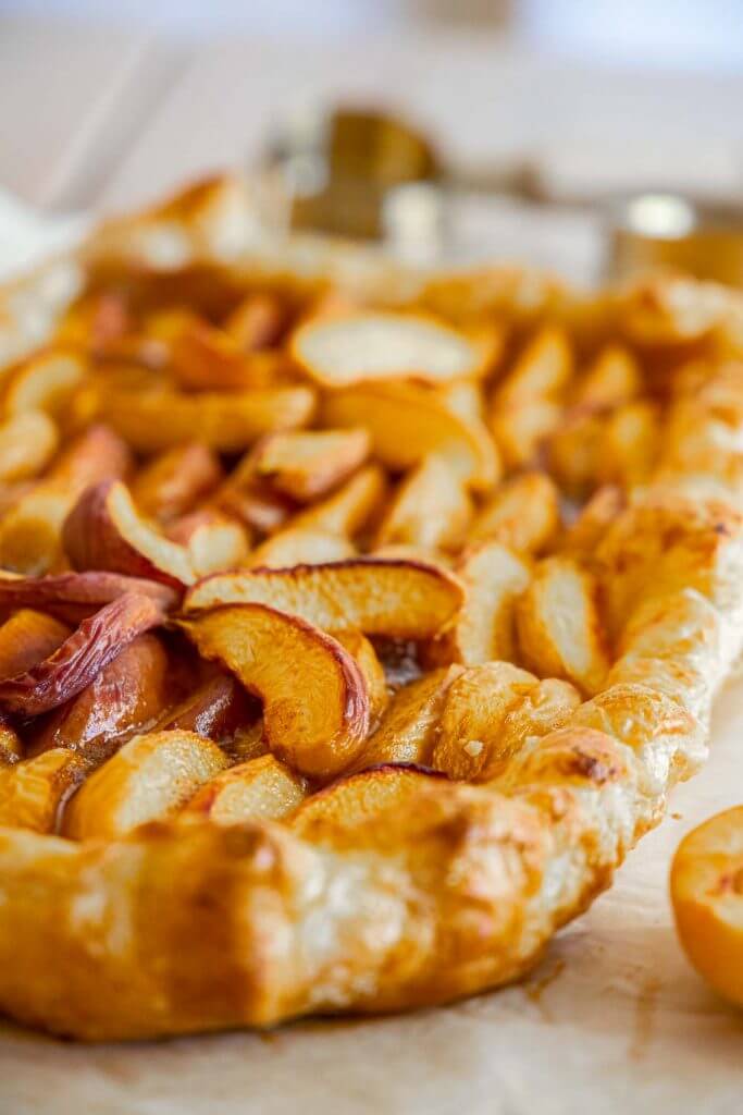Make this easy peach tart using puff pastry ASAP! This peach puff pastry dessert is the perfect balance of sweet, buttery, tart goodness!