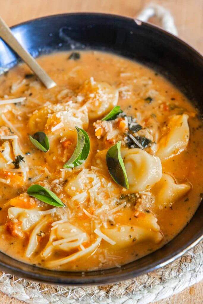 Make this amazing one pot creamy spicy sausage and tortellini soup in 30 minutes. It is easy to make and so very flavorful.