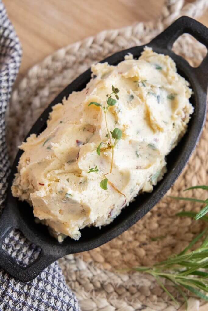 How to make an amazing herb butter with pure maple syrup, fresh herbs, garlic, parmesan cheese, and seas salt. Great for breads and more.