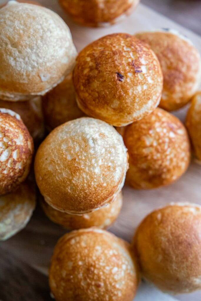 How to make easy sourdough dutch pancakes or sourdough aebleskivers. This is a great breakfast option. These little fluffy round pancake balls are perfect topped with fruit,  syrups, sauces, whipped cream and more.
