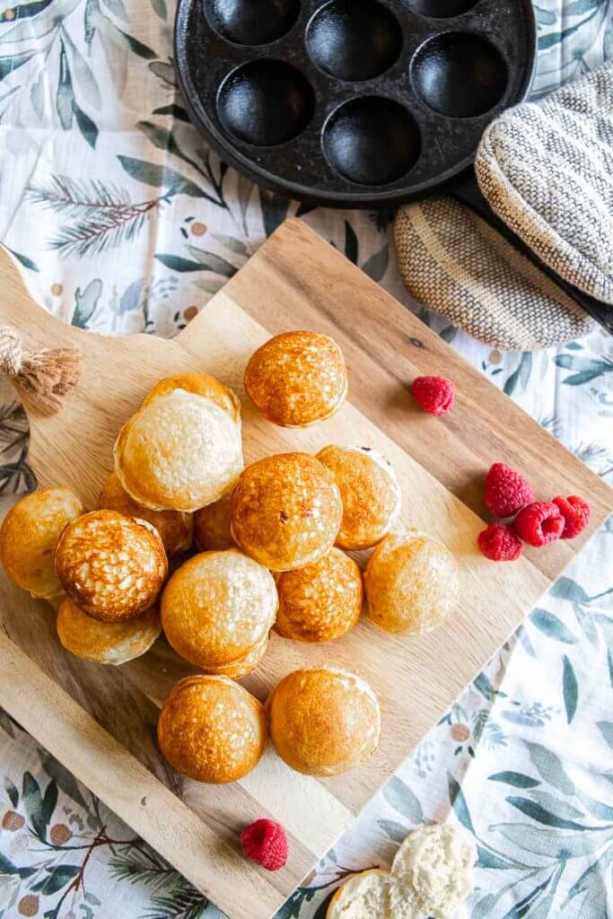 How to make easy sourdough dutch pancakes or sourdough aebleskivers. This is a great breakfast option. These little fluffy round pancake balls are perfect topped with fruit, syrups, sauces, whipped cream and more.
