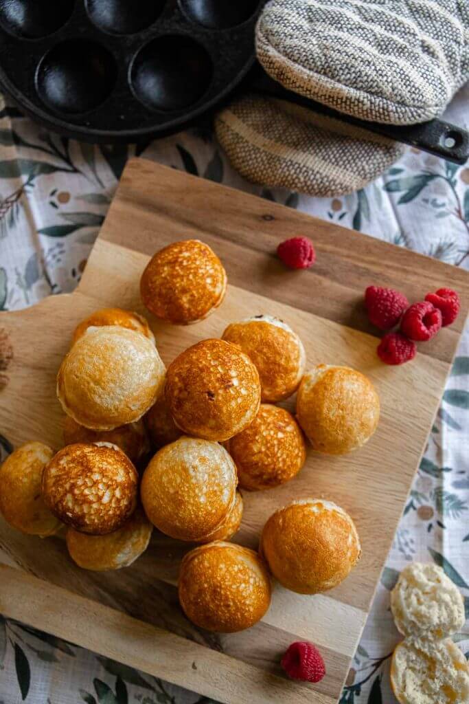 How to make easy sourdough dutch pancakes or sourdough aebleskivers. This is a great breakfast option. These little fluffy round pancake balls are perfect topped with fruit,  syrups, sauces, whipped cream and more.