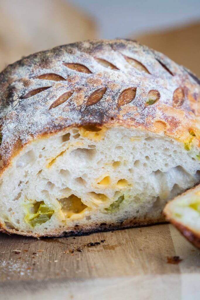 Make this amazing cheddar jalapeno sourdough bread! This requires little work on your part. Its flavor is amazing! The soft pillowy crumb of this sourdough bread is perfect! The flavor of the jalapenos and cheddar make this the perfect option as toast or even use it like you would a bagel! We love this bread as toast and with its crusty outside contrasting the soft inside and its chewy texture, you will want to make an entire meal of it!