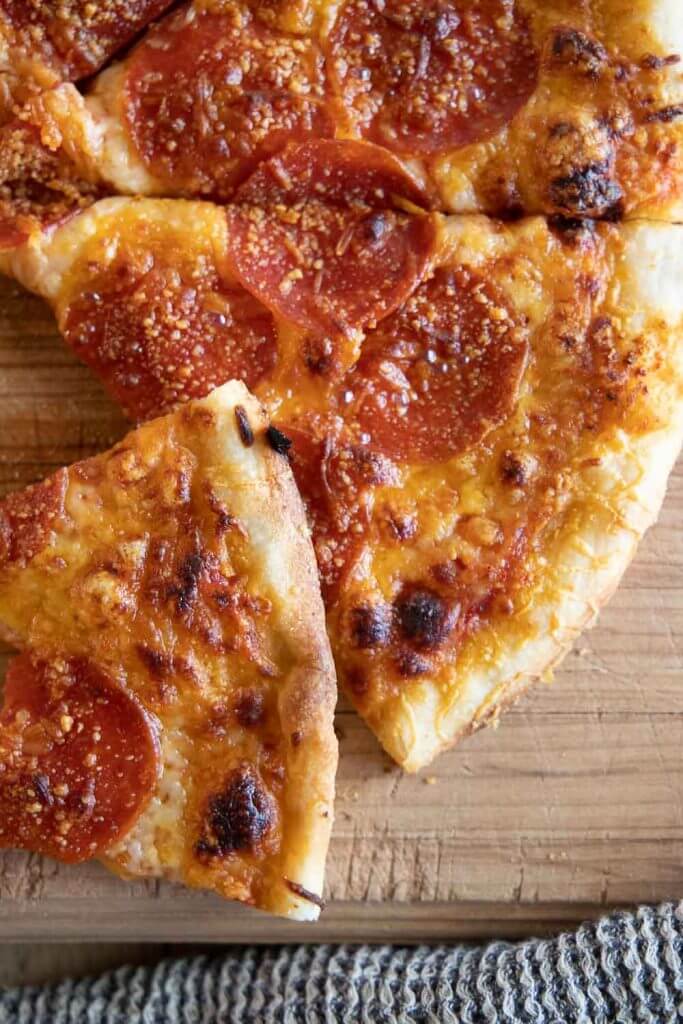 This easy sourdough pizza dough it perfection! Its easy to make and creates the most crispy and flavorful sourdough pizza crust!