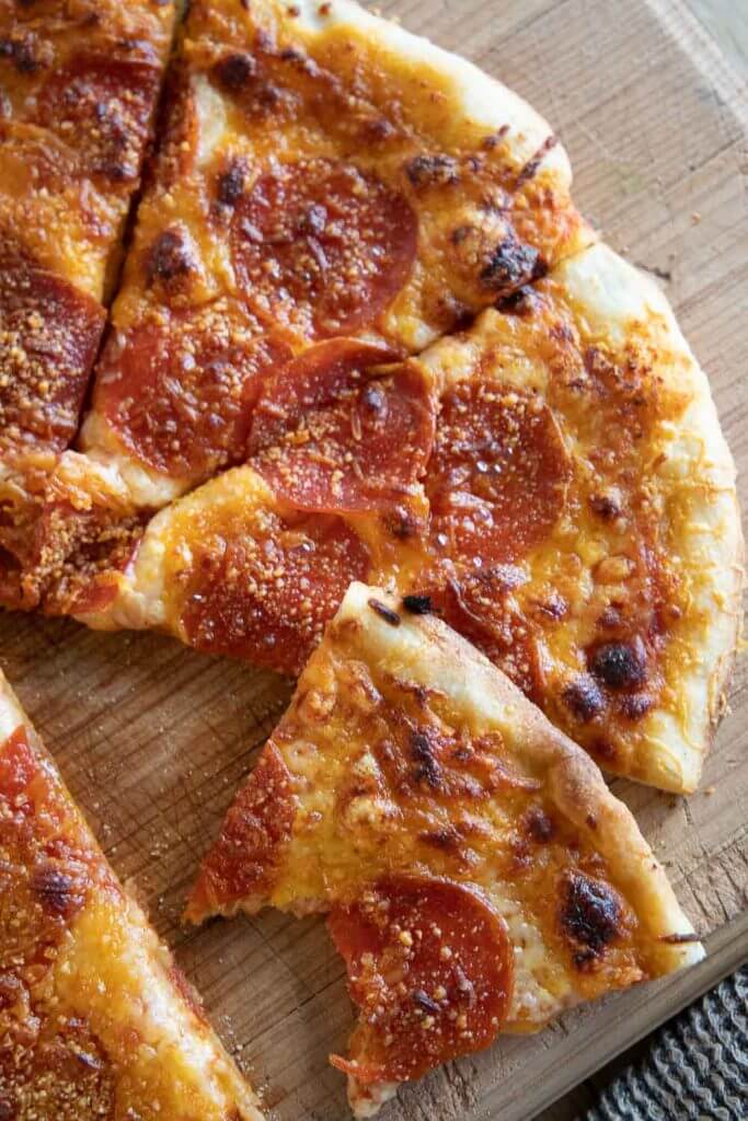 This easy sourdough pizza dough it perfection! Its easy to make and creates the most crispy and flavorful sourdough pizza crust!