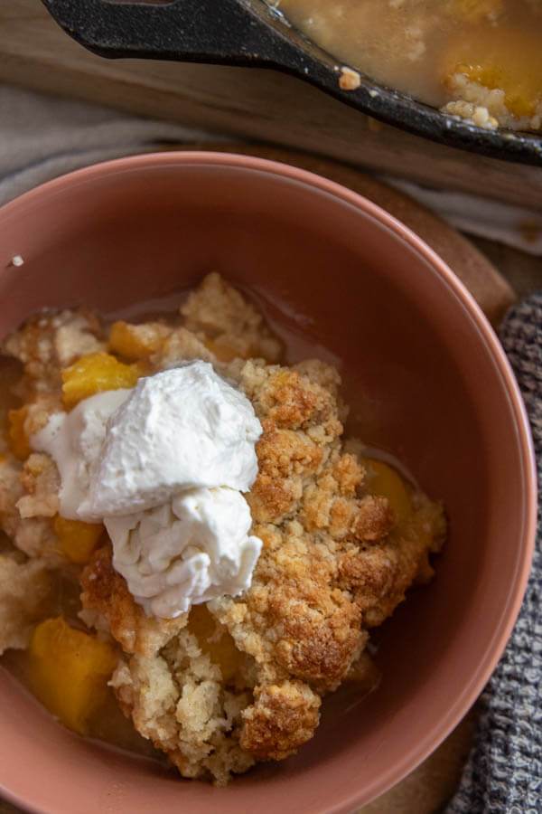 Make this amazing sourdough peach cobbler! It is a great way to use up sourdough discard and make an amazing dessert