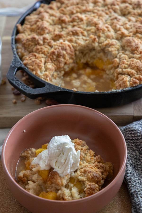 Make this amazing sourdough peach cobbler! It is a great way to use up sourdough discard and make an amazing dessert