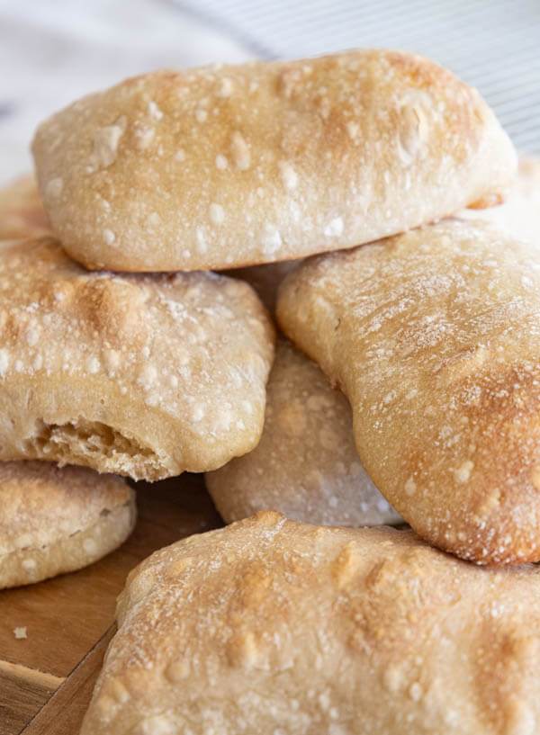 Make this amazing sourdough ciabatta bread and make the best sandwiches ever! It is light and fluffy with a crispy crust. There are oodles of air pockets, which make it perfect to fill with flavorful sandwich ingredients.