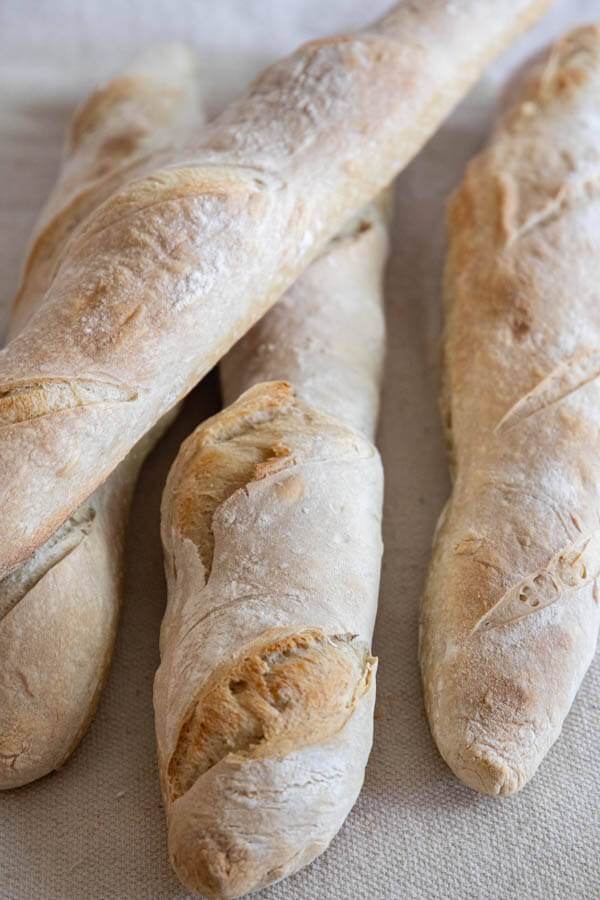 This is a great recipe for sourdough baguettes. These are great for snacking on with cheese or fresh meats, toasted and used for soups and pasta dishes. You can also use them to make rustic sandwiches. Its a great all around sourdough baguette recipe!