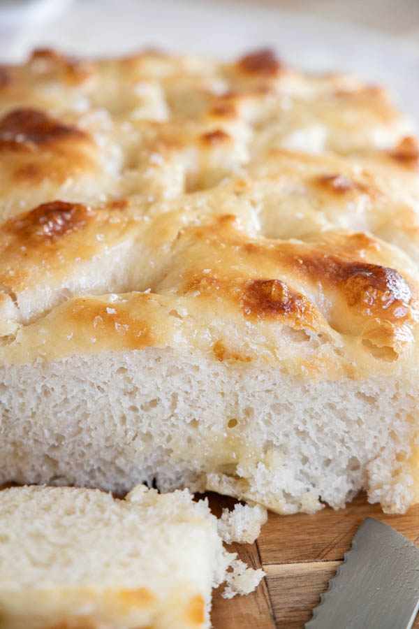 This amazing honey butter sourdough focaccia bread recipe is a glorious take on my regular sourdough focaccia bread. It is light and airy with a sweet buttery glaze on top that makes it unable to resist.