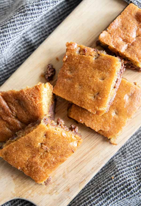 Make these amazing sourdough chocolate chip cookie bars and bring the best treat to your next party! These are super easy to make, no mixer needed. They are decadent, ooey and gooey. Bake them in your cast iron skillet for an even better crispy crust. These are such a popular treat at our house!