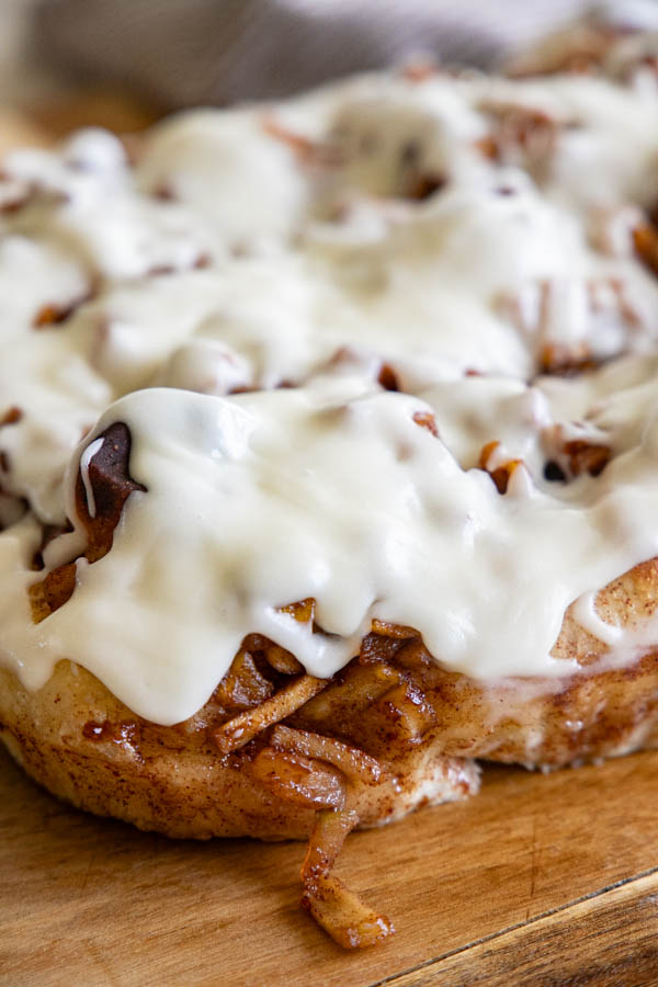 This amazing apple pie sourdough focaccia bread recipe is a glorious take on my regular sourdough focaccia bread. It is light and airy with a sweet and cinnamon spiced apple topping and elevated even more with the addition of a cream cheese icing drizzle.