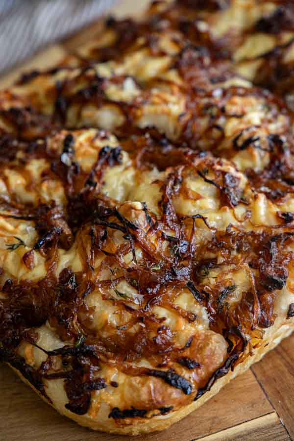 Make this amazing french onion sourdough focaccia bread.  It has an amazing flavor with caramelized onions, gruyere cheese, and fresh herbs.