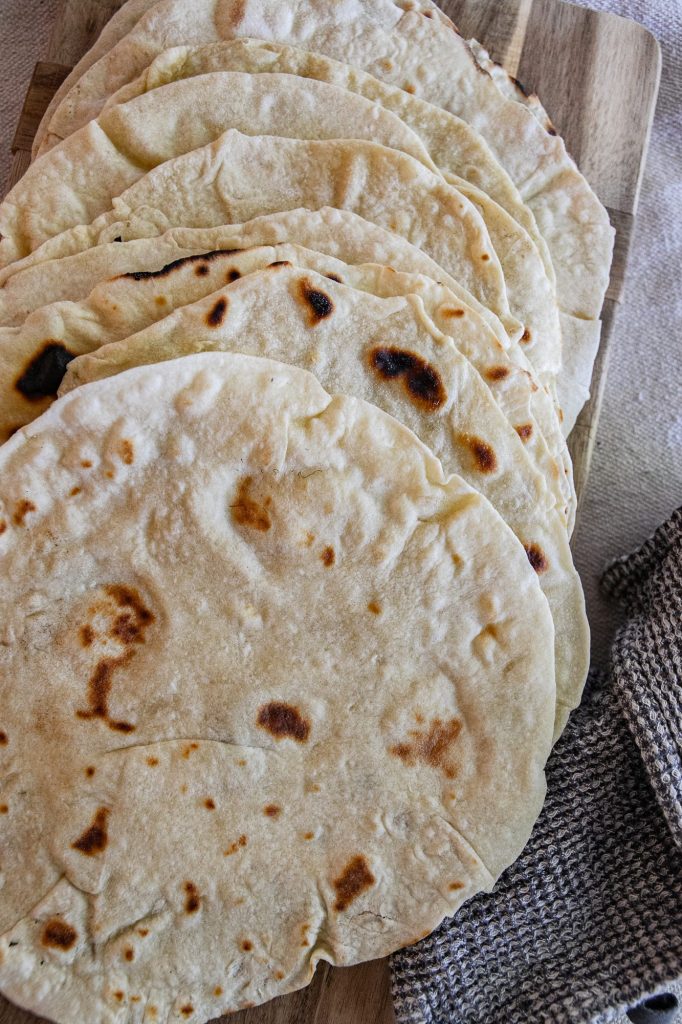 Soft, flexible sourdough tortillas made with simple ingredients and natural fermentation. Easy to roll, tender to bite, and perfect for tacos, wraps, and quesadillas.