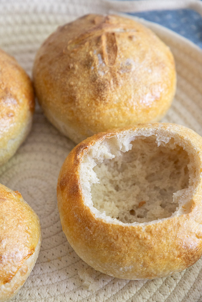 Turn homemade sourdough into beautiful bread bowls! This easy step-by-step guide shows you how to make crusty sourdough bread bowls that are perfect for soup, chili, chowder, and more. Save this recipe for cozy comfort food season!