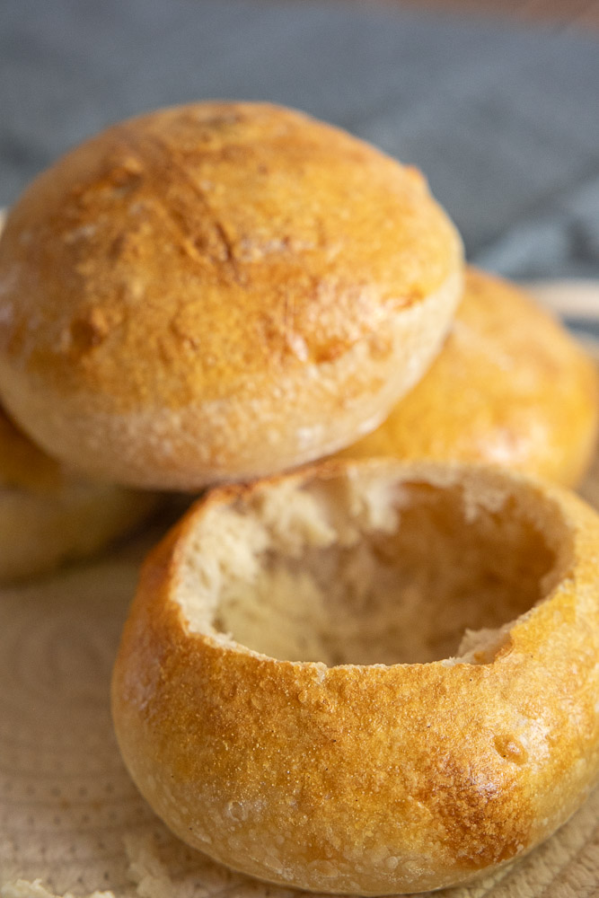 Turn homemade sourdough into beautiful bread bowls! This easy step-by-step guide shows you how to make crusty sourdough bread bowls that are perfect for soup, chili, chowder, and more. Save this recipe for cozy comfort food season!